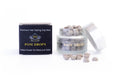 Jar of POM DROPS with the product box;  Pellets on the white background -- showing off the pellet feature 